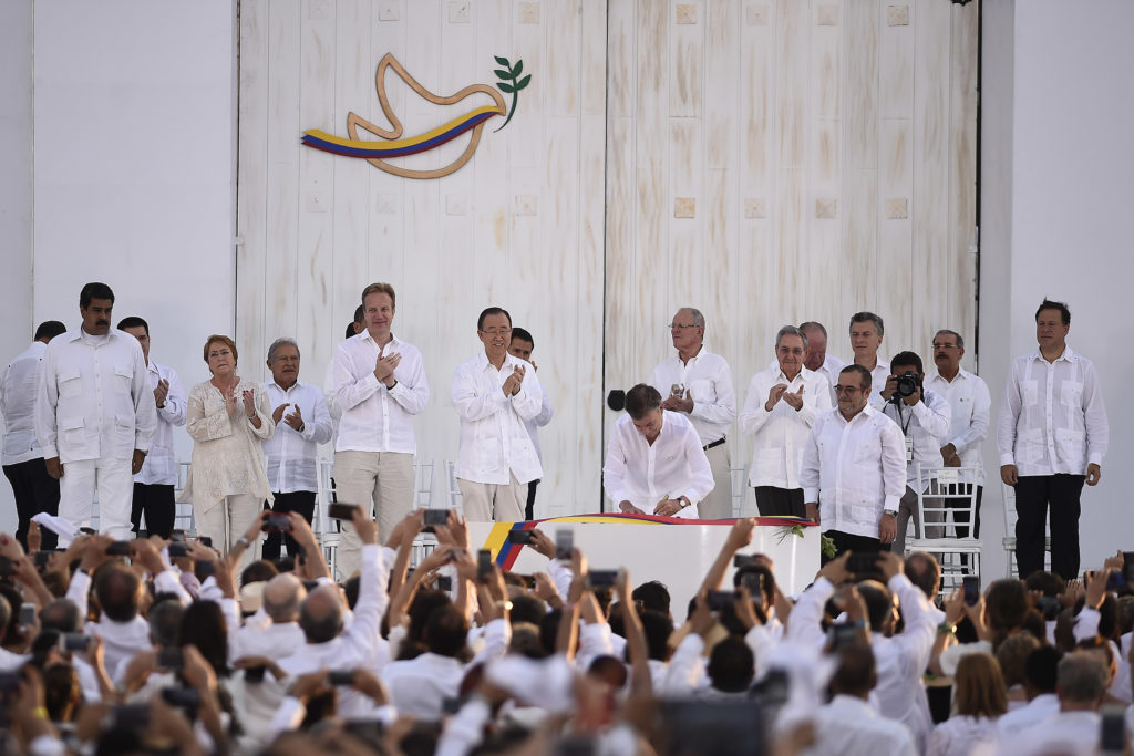 Colombian President Juan Manuel Santos signs the Peace Accords with the FARC in 2016.