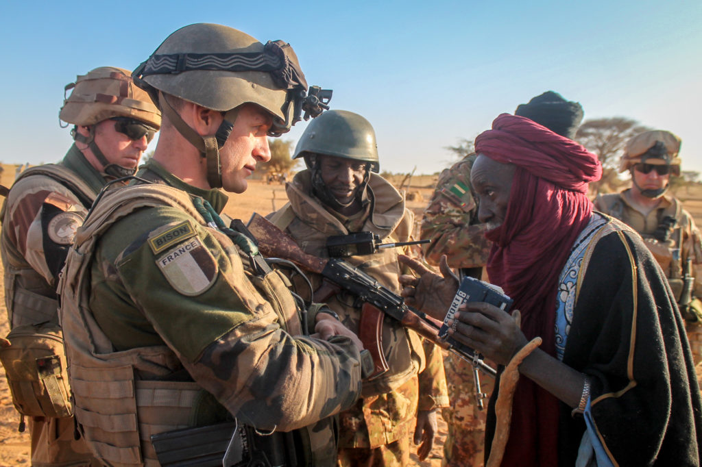 French soldiers talk to locals in southern Mali in 2016. 