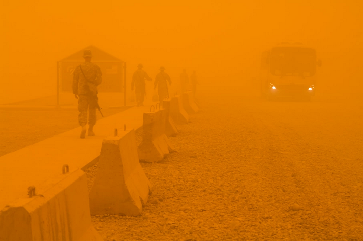 U.S. Soldiers walk from the dining facility during a sandstorm at Forward Operating Base Warhorse, Iraq, July 4 (2009).