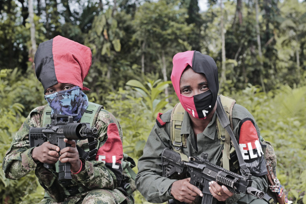 Members of Colombia’s National Liberation Army, which operates along the border area between Colombia and Venezuela, pose with their weapons.