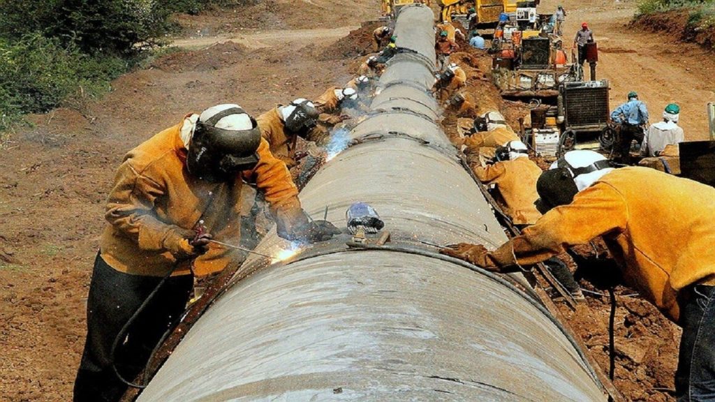 Workers construct a pipeline in Iran near Azerbaijan.