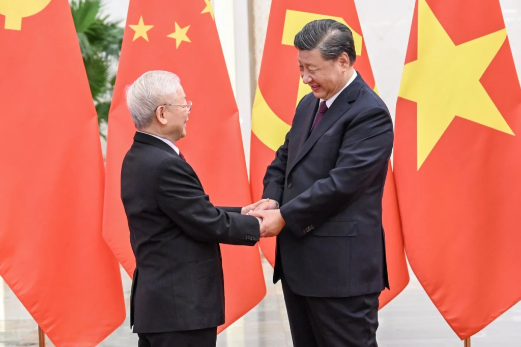 Ngo 01 Chinese President Xi Jinping right shakes hands with Vietnams Communist Party chief Nguyen Phu Trong left in Beijing